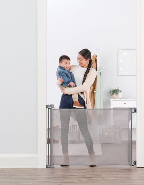 Load image into Gallery viewer, Retractable Baby Gate, Expands up to 50&quot; Wide, Includes Wall Mounts
